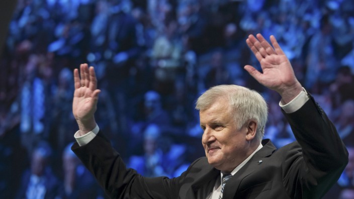 Bavarian state premier and leader of Christian Social Union (CSU) Horst Seehofer waves after his speech at the party's traditional Ash Wednesday meeting in Passau