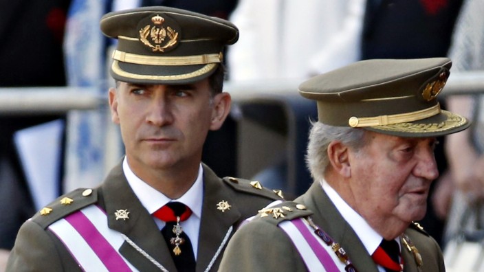Spain's Crown Prince Felipe and King Juan Carlos attend a ceremony at the Monastery of San Lorenzo de El Escorial outside Madrid