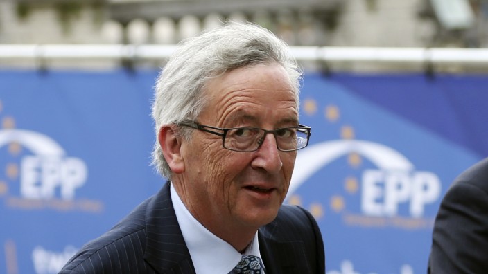 Candidate for the European Commission presidency Juncker arrives at an EPP meeting in Brussels