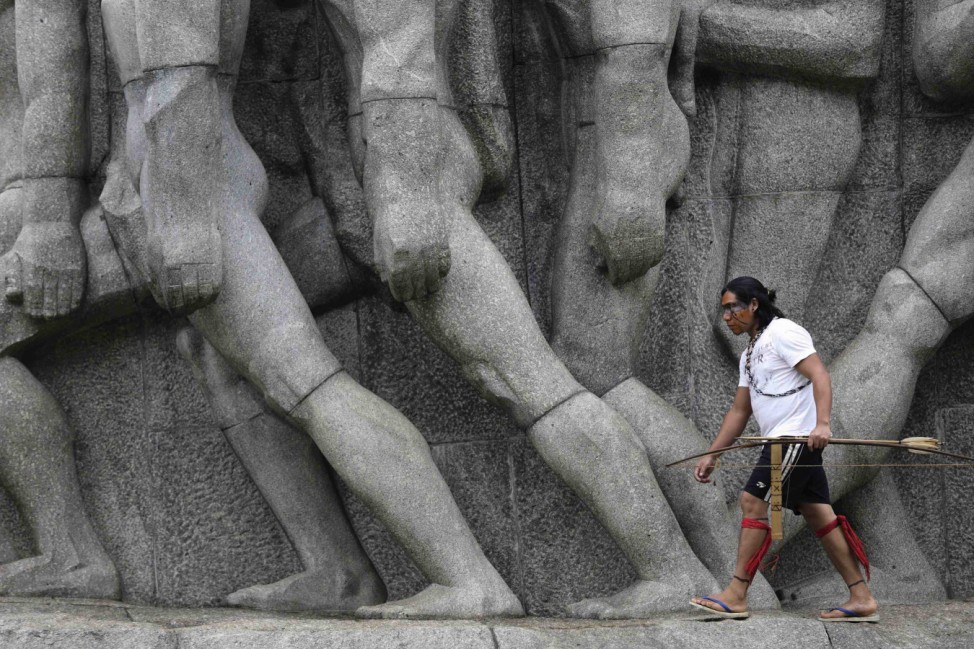 Guarani Indians occupy the 'Bandeirantes' monument during a protest in Sao Paulo