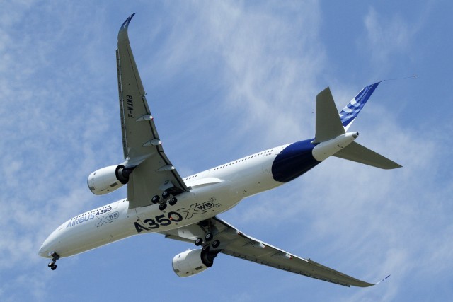 The new Airbus A350 flies over Toulouse-Blagnac airport during its maiden flight in southwestern France