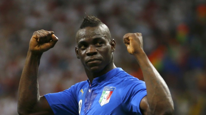 Italy's Mario Balotelli celebrates after goal past England during World Cup soccer match at the Amazonia arena