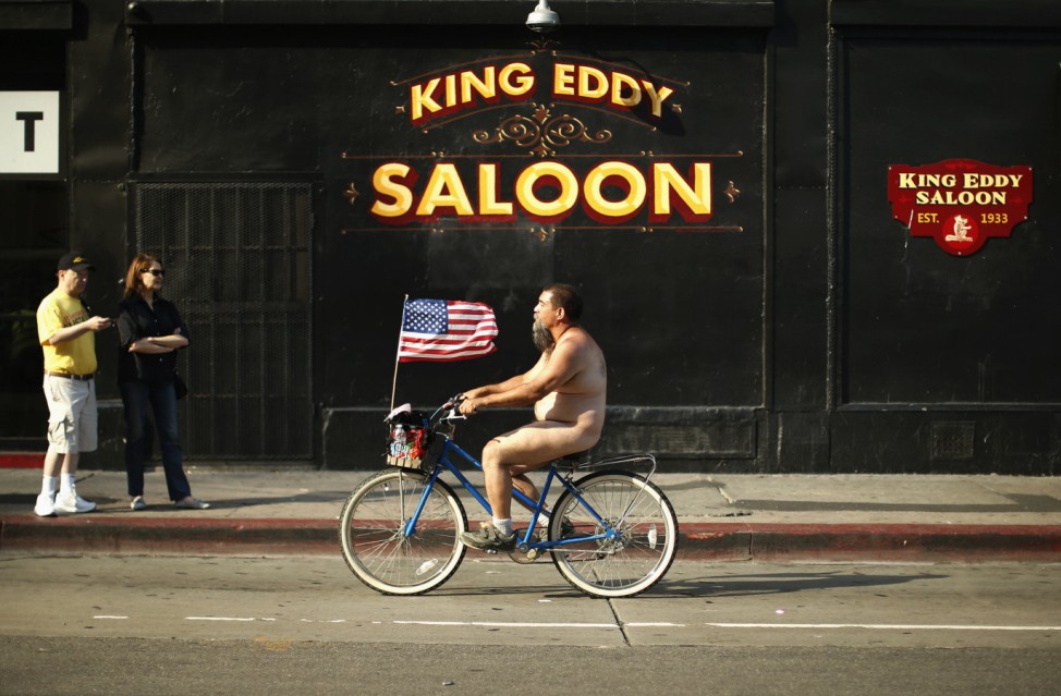 People ride in the World Naked Bike Ride in Los Angeles
