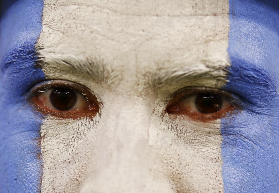 A fan of Argentina waits for the start of their 2014 World Cup Group F soccer match against Bosnia at the Maracana stadium in Rio de Janeiro