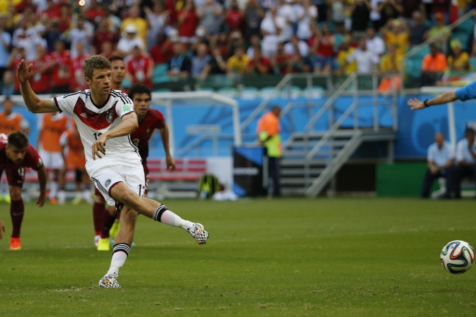 Germany's Mueller scores a goal from a penalty shot during their 2014 World Cup Group G soccer match against Portugal at the Fonte Nova arena in Salvador