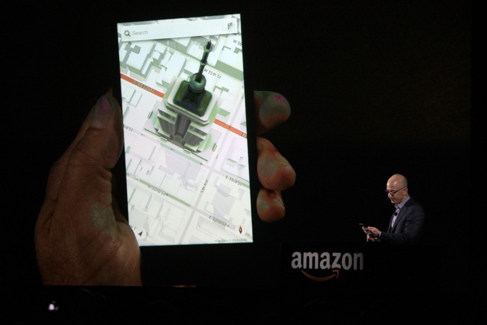 Amazon CEO Jeff Bezos shows off the 3D features of his company's new Fire smartphone in Seattle, Washington