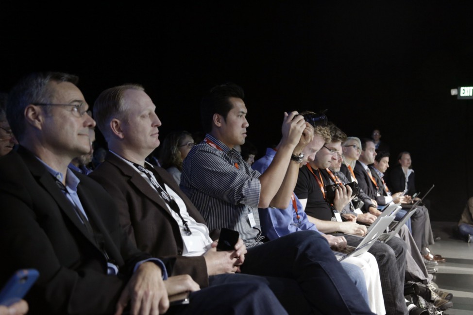 Guests listen to Amazon CEO Jeff Bezos discuss his company's new Fire smartphone in Seattle, Washington