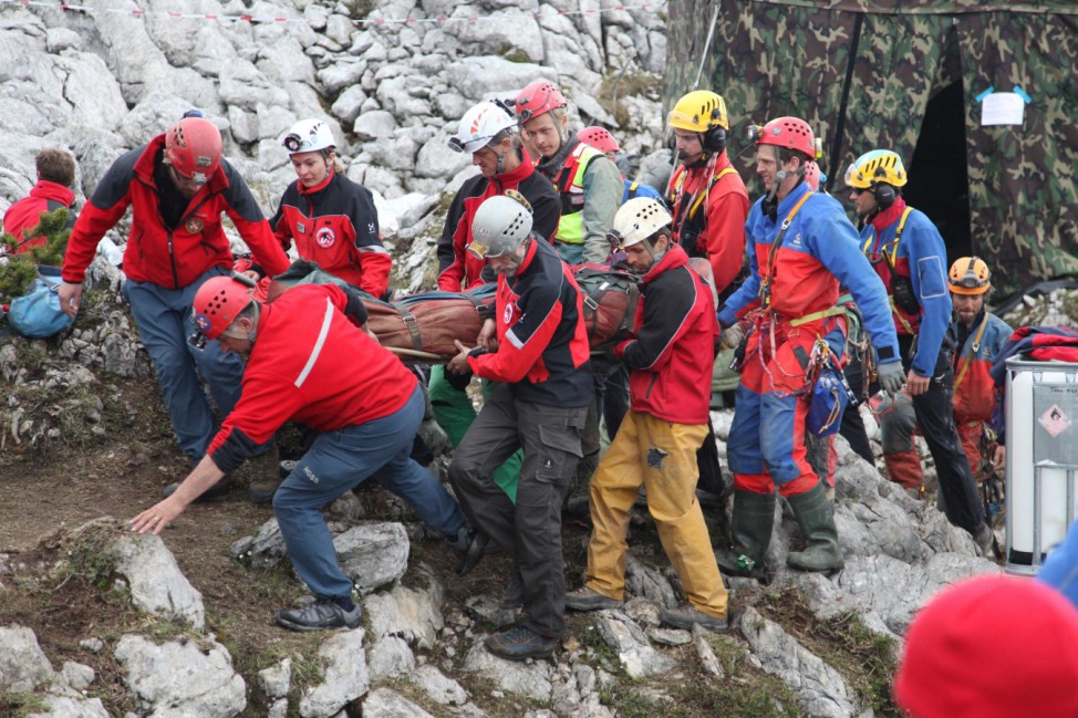 Bavaria's mountain rescue team 'Bergwacht Bayern' carry injured researcher Westhauser outside the Riesending cave in Untersberg