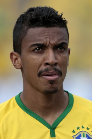 File photo of Brazil's Luiz Gustavo posing for a team photo before their international friendly soccer match against Panama in Goiania