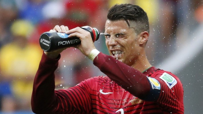 Portugal's Cristiano Ronaldo refreshes himself during the 2014 World Cup Group G soccer match between Portugal and Ghana at the Brasilia national stadium