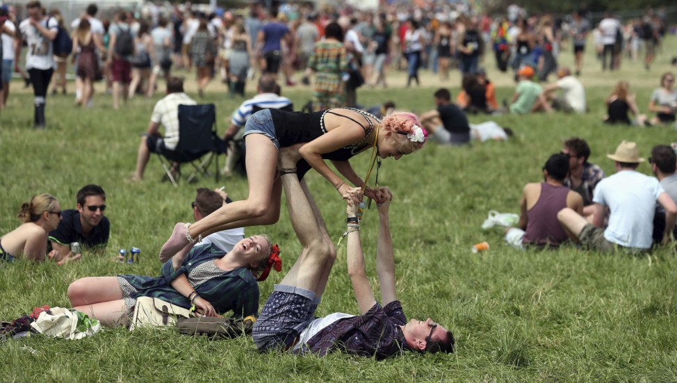 Festival goers are pictured in front of the Pyramid Stage at Worthy Farm in Somerset, on the second day of the Glastonbury music festival