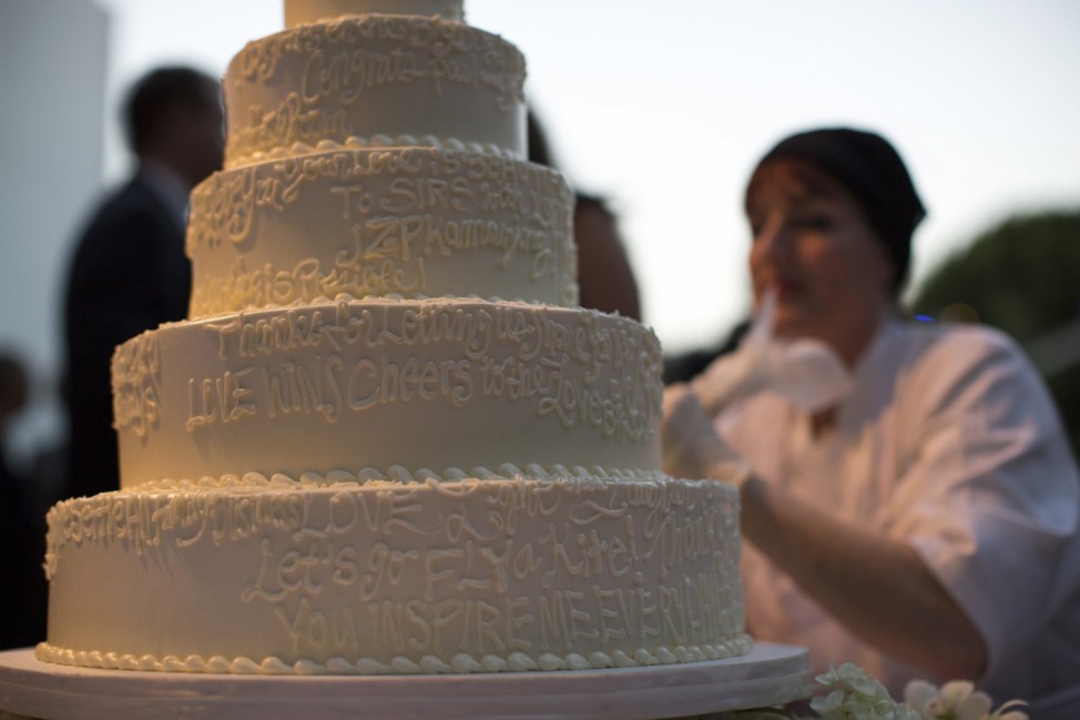 A wedding cake is decorated with messages from guests at a ceremony to celebrate the wedding of Paul Katami and Jeff Zarrillo at Beverly Hilton Hotel in Beverly Hills