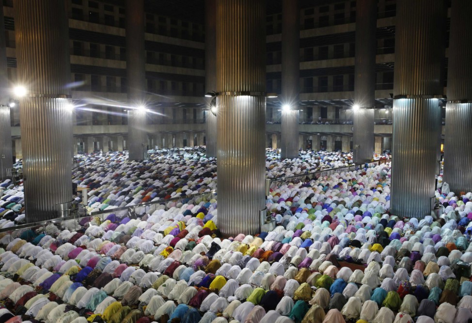Muslims attend an evening mass prayer session to mark Ramadan in Jakarta