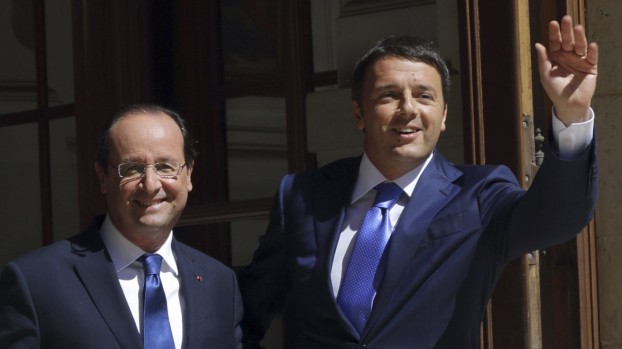 French President Francois Hollande and Italian Prime Minister Matteo Renzi arrive at the Hotel Marigny to attend a meeting of European Social-Democrat leaders in Paris