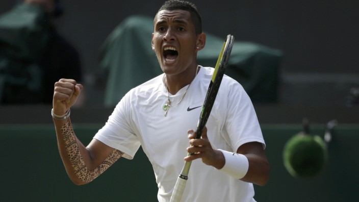 Nick Kyrgios of Australia reacts during his men's singles tennis match against Rafael Nadal of Spain at the Wimbledon Tennis Championships, in London
