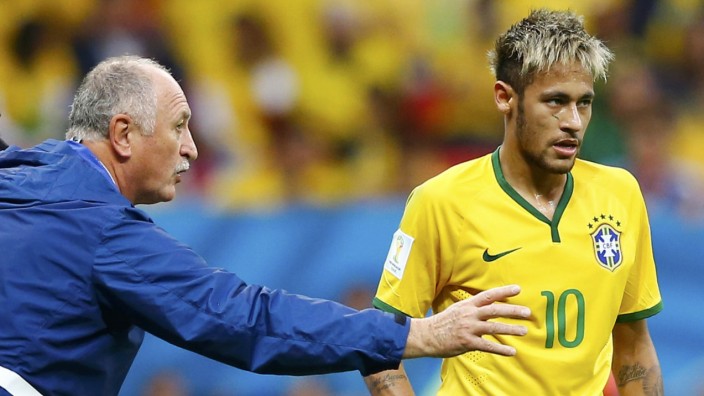 Brazil's coach Luiz Felipe Scolari gives instructions to Neymar during their 2014 World Cup Group A soccer match against Cameroon at the Brasilia national stadium in Brasilia