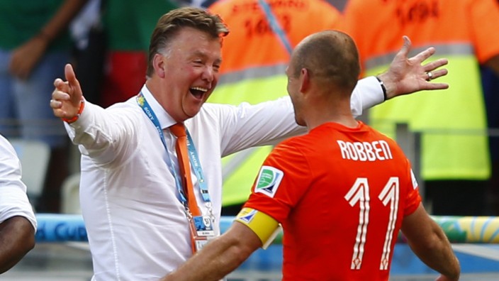 Netherlands coach Louis van Gaal celebrates with Arjen Robben after winning their 2014 World Cup round of 16 game against Mexico at the Castelao arena in Fortaleza