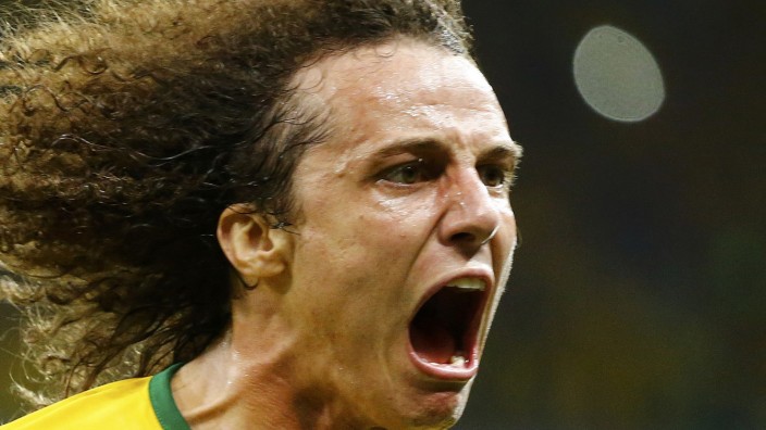 Brazil's Luiz celebrates after scoring a goal against Colombia during the 2014 World Cup quarter-finals soccer match at the Castelao arena in Fortaleza