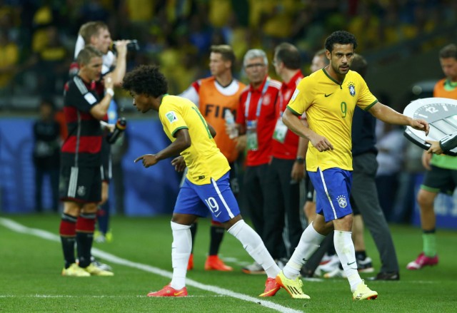 Brazil's Willian substitutes Fred during the 2014 World Cup semi-finals between Brazil and Germany at the Mineirao stadium