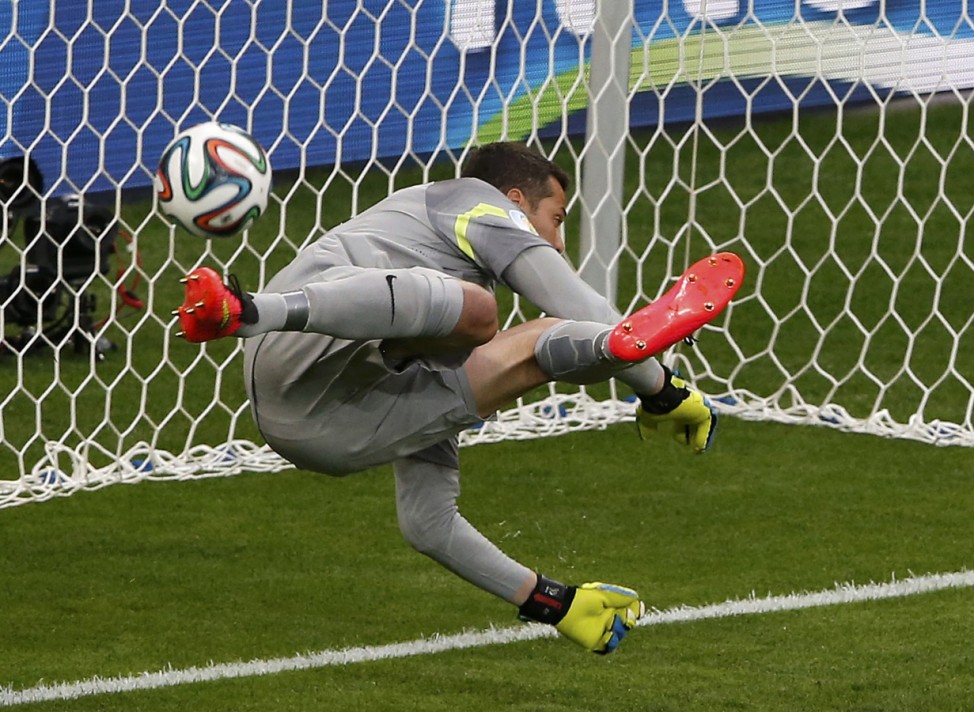 Brazil's goalkeeper Cesar fails to save a goal by Germany's Mueller during their 2014 World Cup semi-finals at the Mineirao stadium in Belo Horizonte