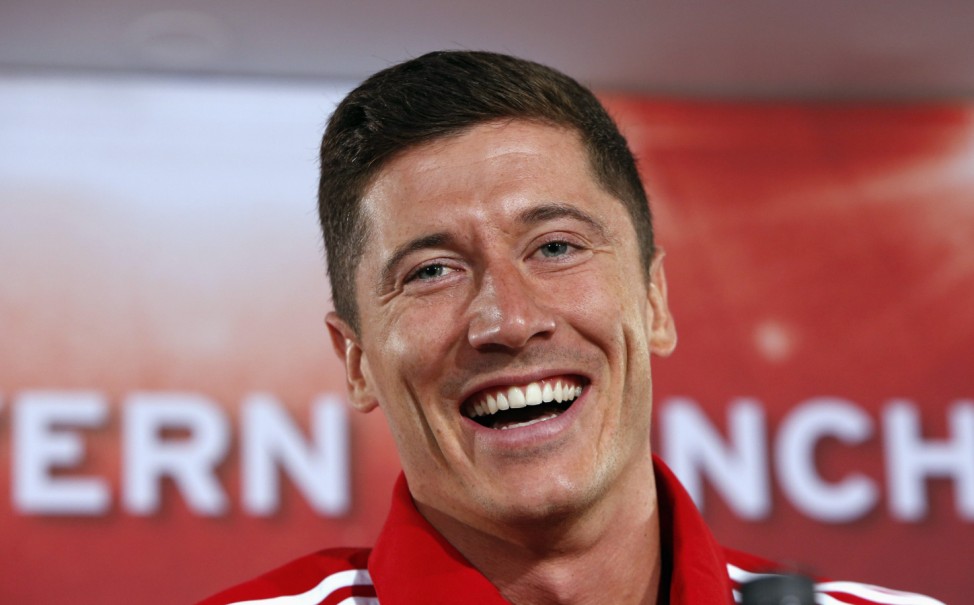 New Bayern Munich soccer player Lewandowski reacts during news conference in Munich