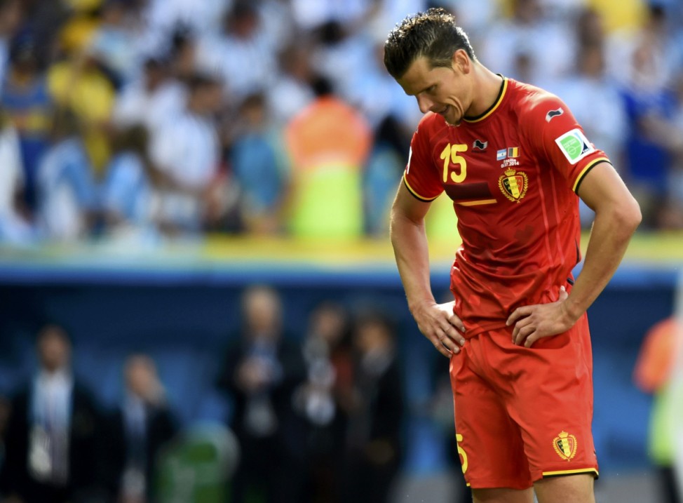 Belgium's Van Buyten reacts after the team's 2014 World Cup quarter-finals against Argentina at the Brasilia national stadium in Brasilia