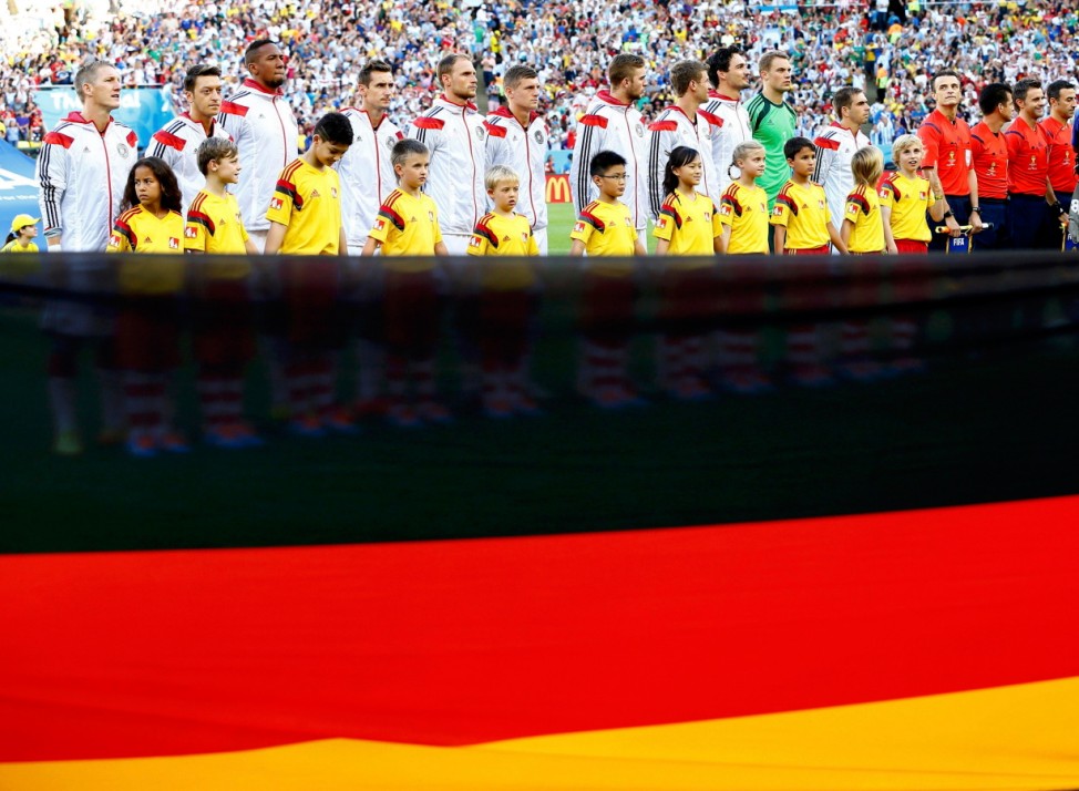 Germany players stand for the anthem before the 2014 World Cup final between Germany and Argentina at the Maracana stadium