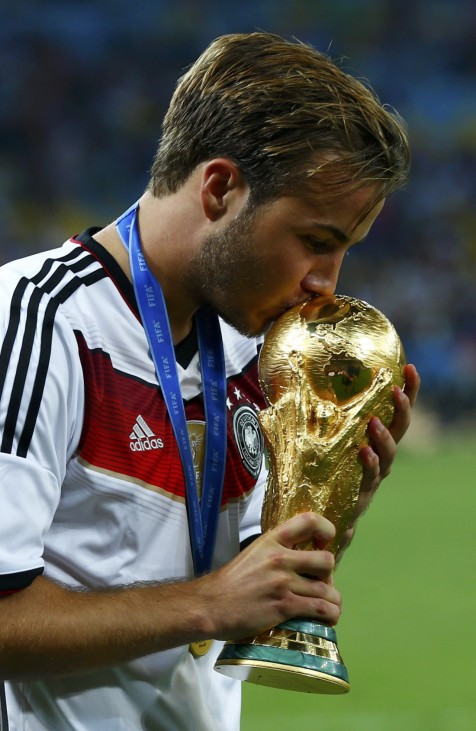 Germany's Mario Goetze kisses the World Cup trophy after the 2014 World Cup final against Argentina at the Maracana stadium in Rio de Janeiro