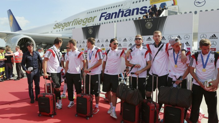 German soccer team stand in front of the plane at Tegel airport in Berlin