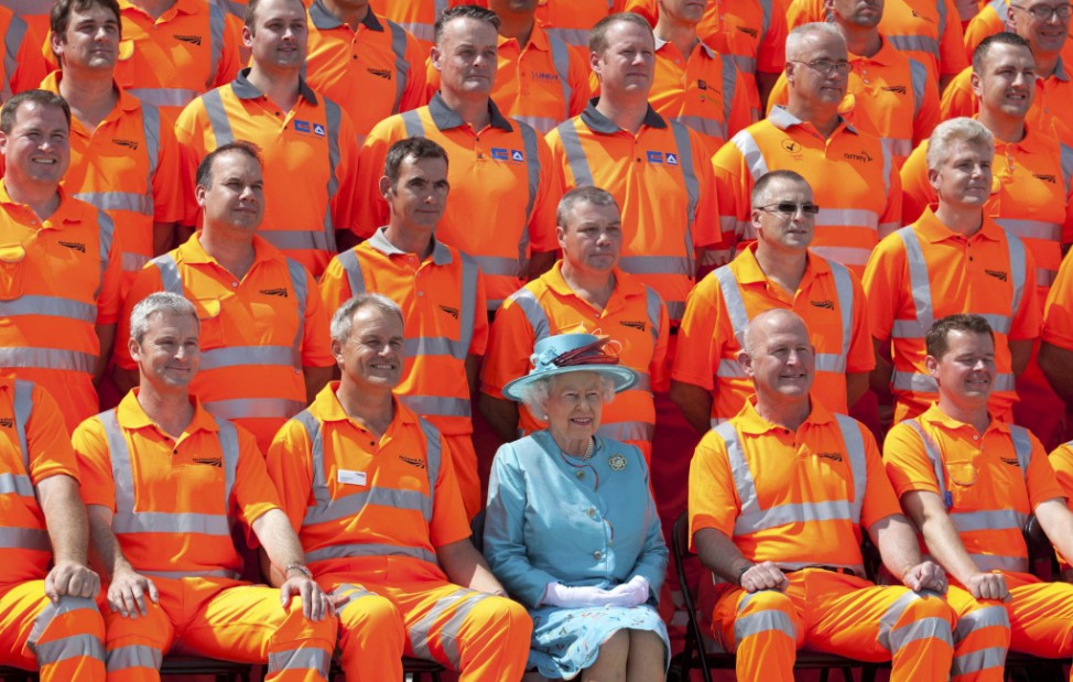 Britain's Queen Elizabeth meets construction workers as she attends the official opening of the refurbished Reading Station, west of London