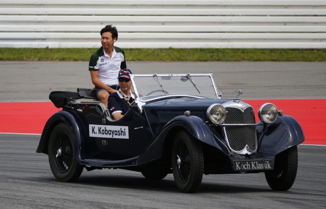 Caterham Formula One driver Kobayashi of Japan takes part in drivers parade prior to German F1 Grand Prix at Hockenheim