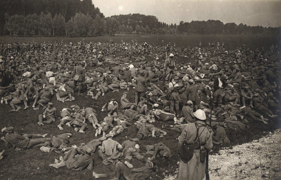Captured German prisoners lie down in a field at Longueau, on the Western Front, in this August 1, 1916 handout picture