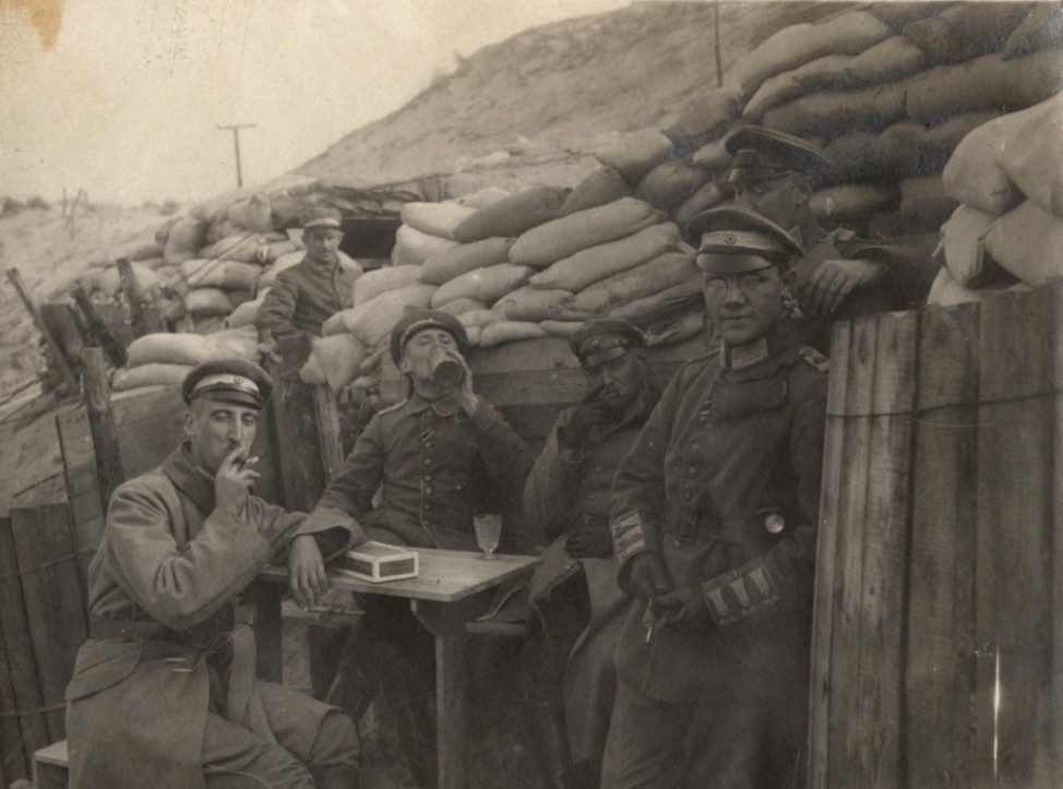 German officers sit outside dugouts on the Yser Front in Belgium in this 1917 handout picture
