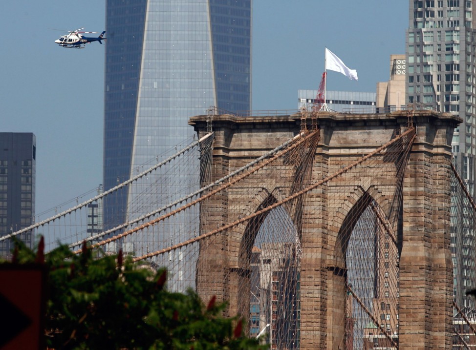 White flags fly on the Brooklyn Bridge
