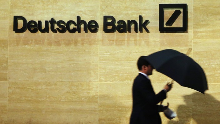 A man walks past Deutsche Bank offices in London