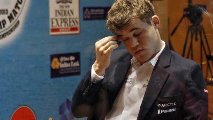 Norway's Carlsen plays against India's Anand during the FIDE World Chess Championship in Chennai