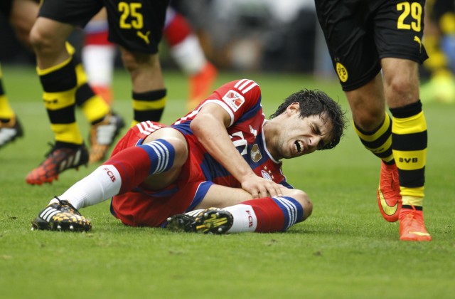 Bayern Munich's Javier Martinez is injured during the SuperCup 2014 soccer match against Borussia Dortmund in Dortmund