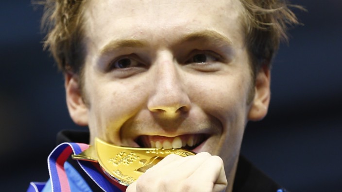 Gold medallist Koch of Germany poses after winning the men's 200m breaststroke final at the European Swimming Championships in Berlin