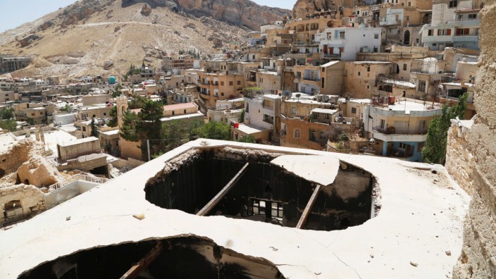 A general view shows damage in the city of Maaloula