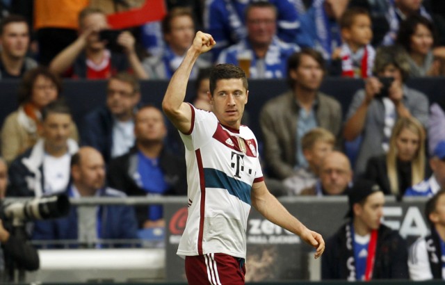Bayern Munich's Lewandowski celebrates a goal against Schalke 04 during their German first division Bundesliga soccer match in Gelsenkirchen
