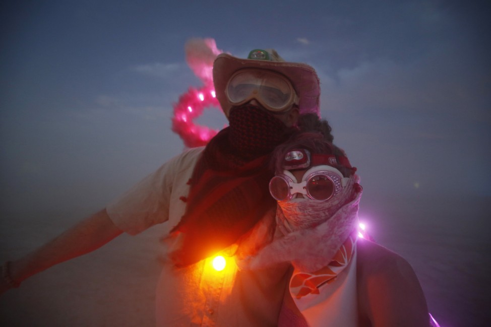 Wade Harrell and his wife Heather Harrell geared up for the dust during the Burning Man 2014 'Caravansary' arts and music festival in the Black Rock Desert of Nevada