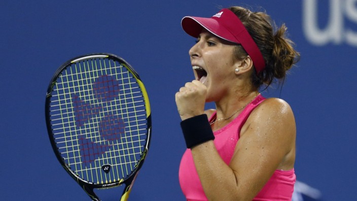 Belinda Bencic of Switzerland reacts to winning the first set against Jelena Jankovic of Serbia in their women's singles match at the U.S. Open tennis tournament in New York