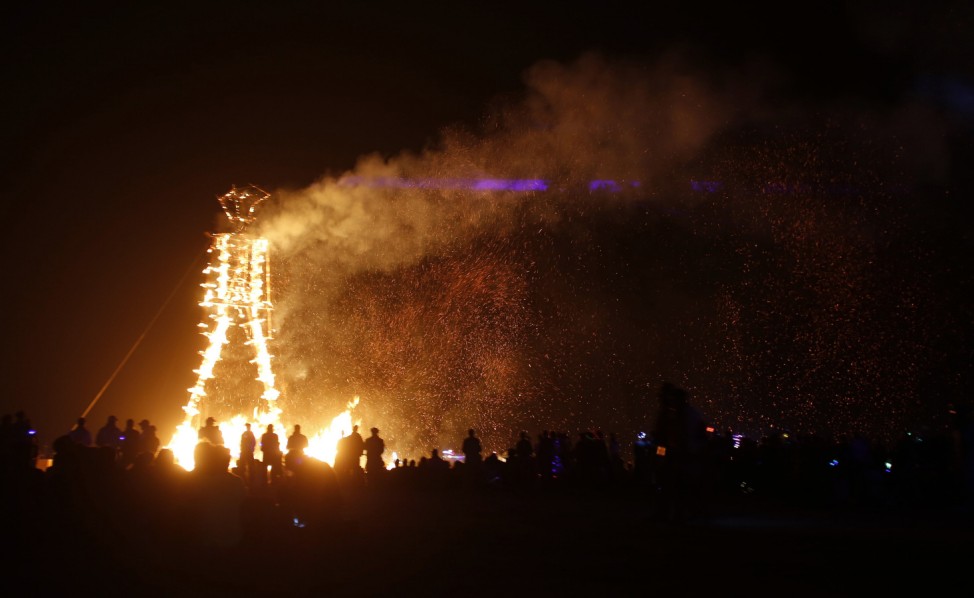 The Man burns during the Burning Man 2014 'Caravansary' arts and music festival in the Black Rock Desert of Nevada