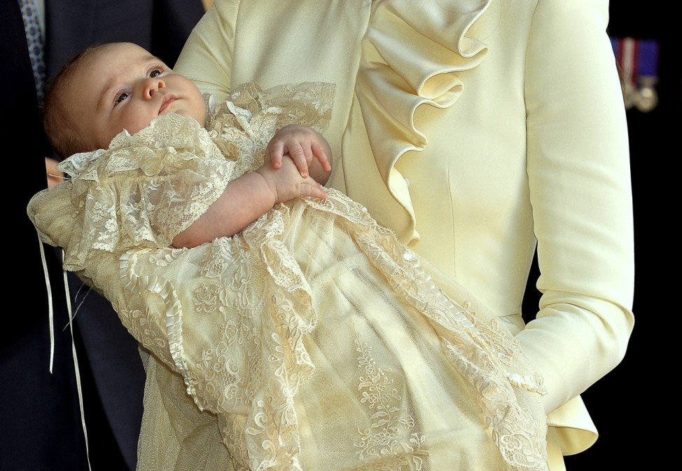 Britain's Catherine, Duchess of Cambridge carries her son Prince George after his christening at St James's Palace in London