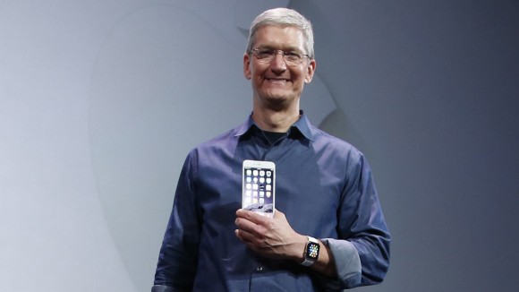 Apple CEO Tim Cook shows the iPhone 6 Plus during an Apple event at the Flint Center in Cupertino