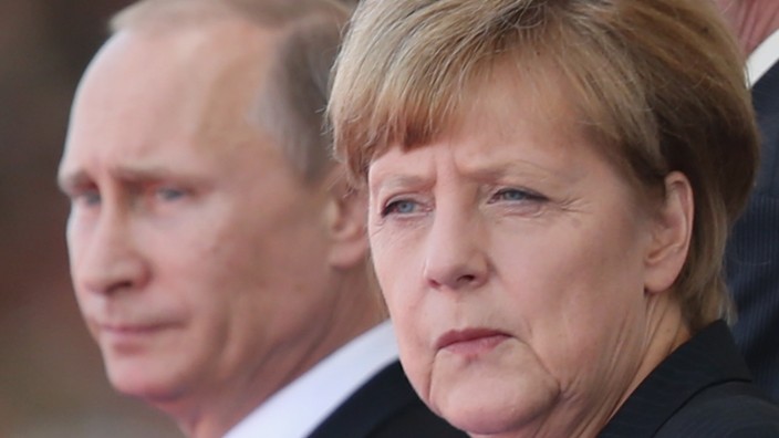 (FILE): Putin And Merkel Attend D-Day Commemoration