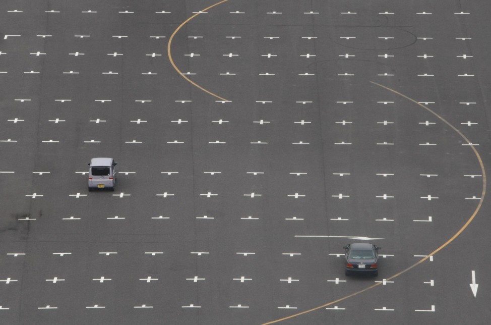 File photo of cars parked at a parking lot nearby a shopping mall in Tokyo