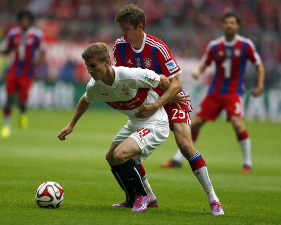 Munich's Mueller challenges Stuttgart's Werner during their German first division Bundesliga soccer match in Munich