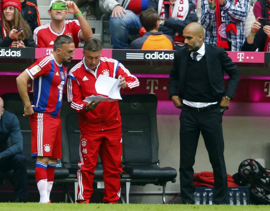 Ribery receives instructions before he enters the match against VfB Stuttgart during their German first division Bundesliga soccer match in Munich