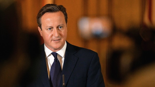 Britain's Prime Minister David Cameron makes a statement to the media following the killing of aid worker David Haines